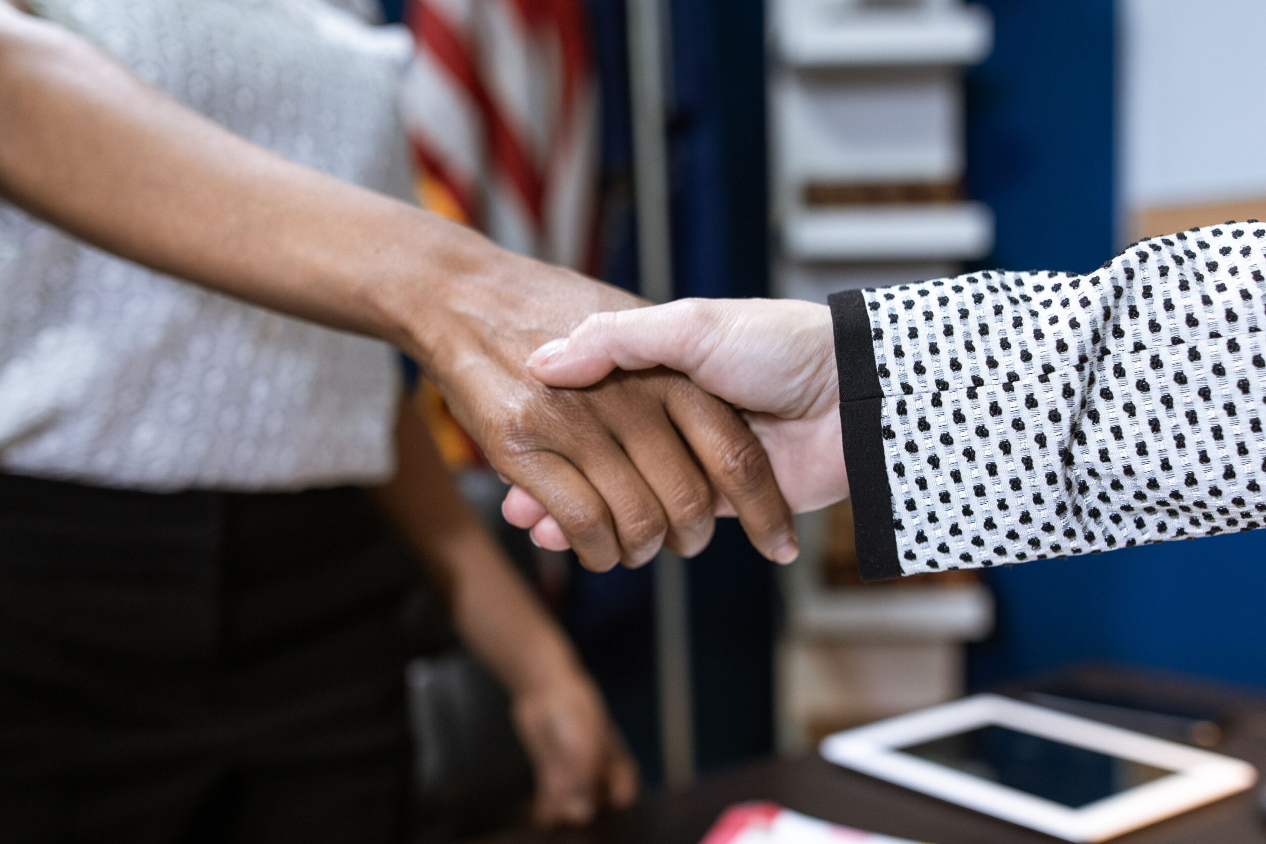 Two people shaking hands.